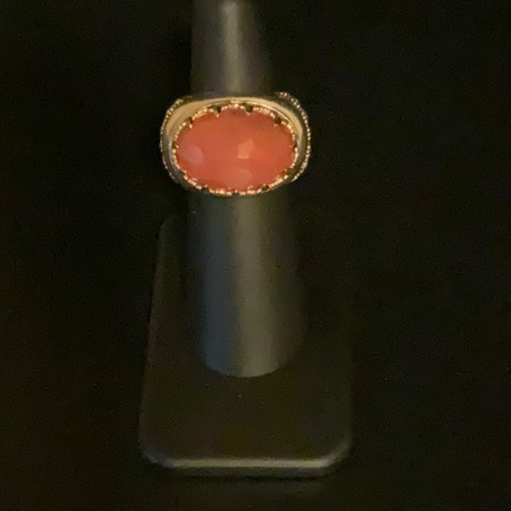 Silver ring with faceted gemstone surrounded by ornate gold trim size 5 1/4.